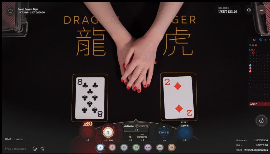 Live dealer Dragon Tiger game showing 8 of clubs on the left and 2 of diamonds on the right.